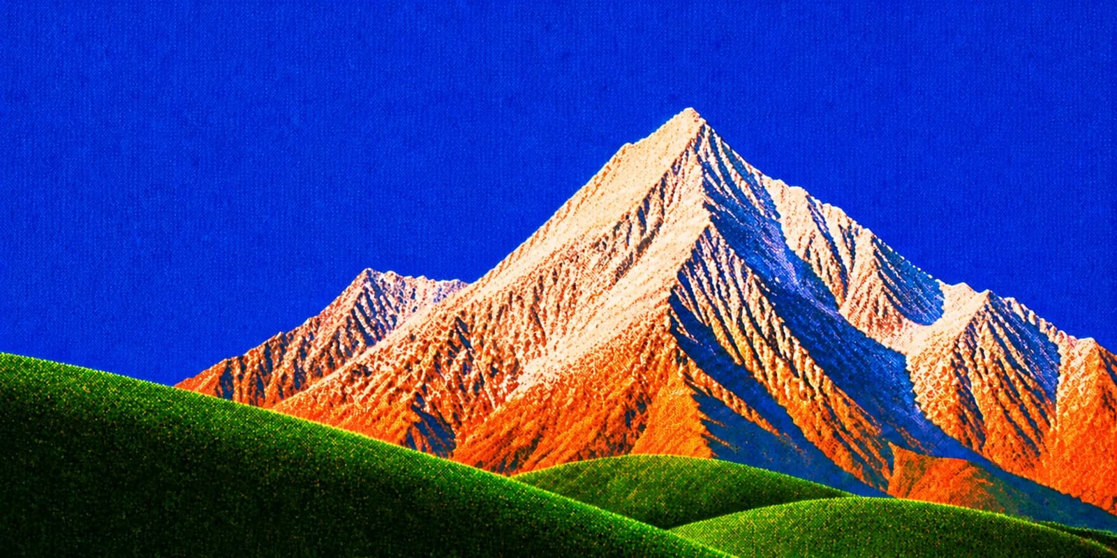 A sunlit mountain summit rising above green foothills at dawn